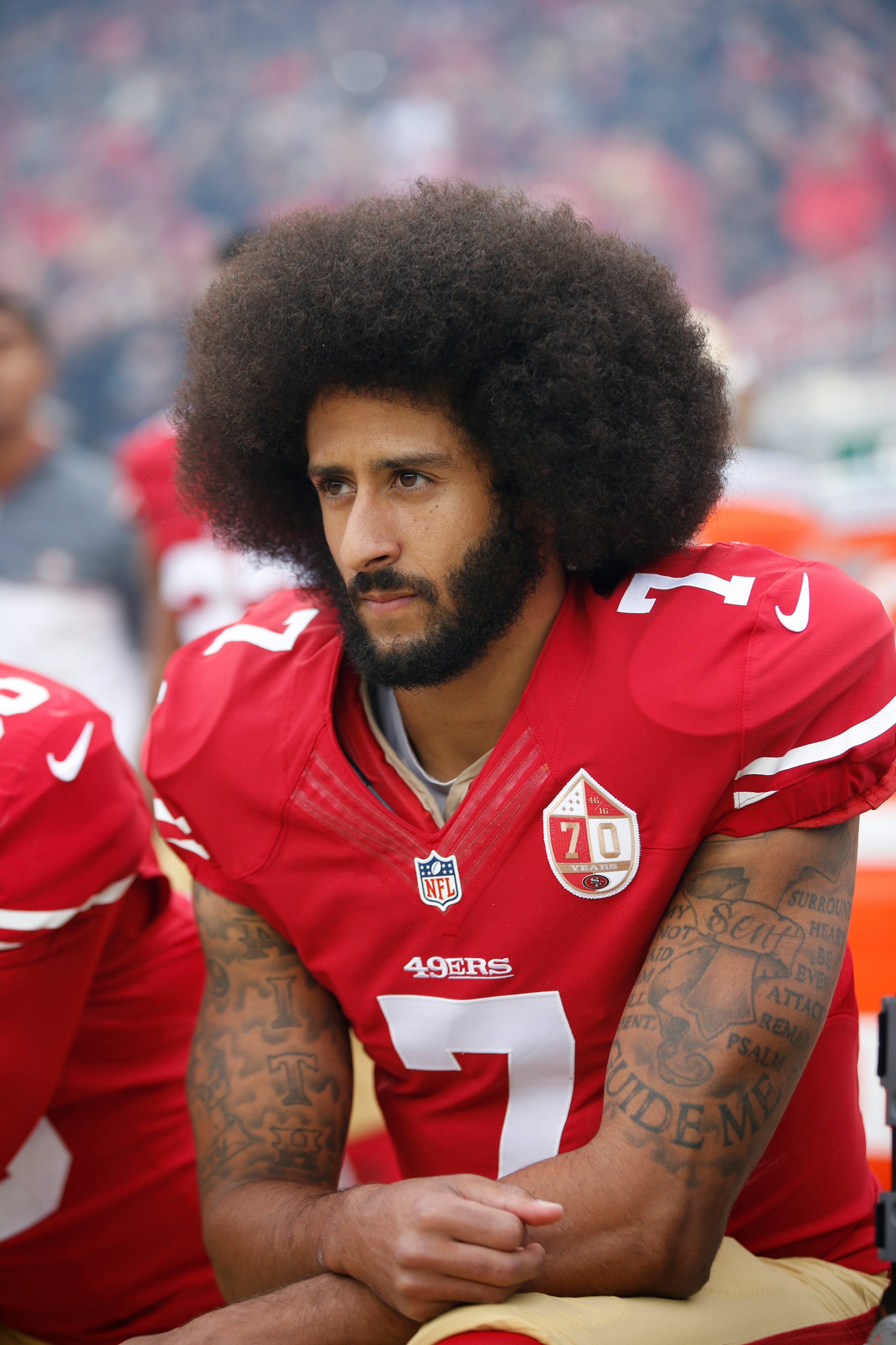 SANTA CLARA, CA - DECEMBER 11: Colin Kaepernick #7 of the San Francisco 49ers kneels on the sideline&hellip;