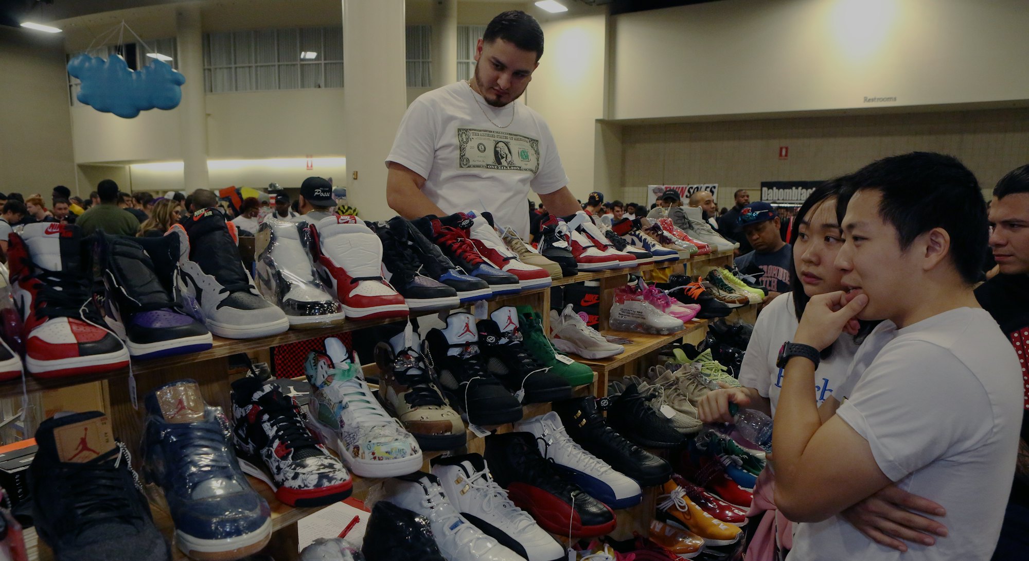 FT LAUDERDALE, FLORIDA - FEBRUARY 02: Shoppers inspect sneakers on sale by Texas Shoe Exchange durin...