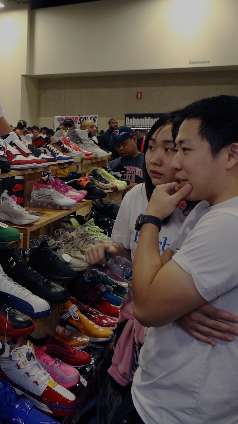 FT LAUDERDALE, FLORIDA - FEBRUARY 02: Shoppers inspect sneakers on sale by Texas Shoe Exchange durin...