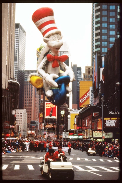 245581 05: A giant balloon of Dr. Seuss'' Cat In The Hat floats in the air at the 69th Macy's Thanks...