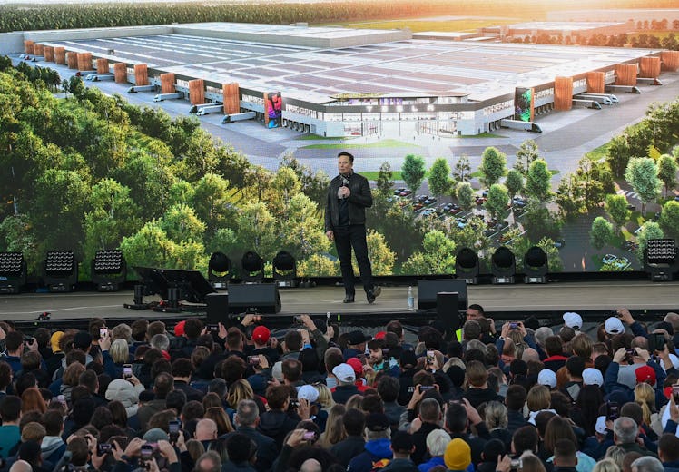 09 October 2021, Brandenburg, Grünheide: Elon Musk, Tesla CEO, stands on a stage at the Tesla Gigafa...