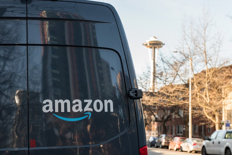 Seattle, USA - Feb 10, 2020: Amazon Prime Now Delivery van on 4th avenue late in the day with the Sp...