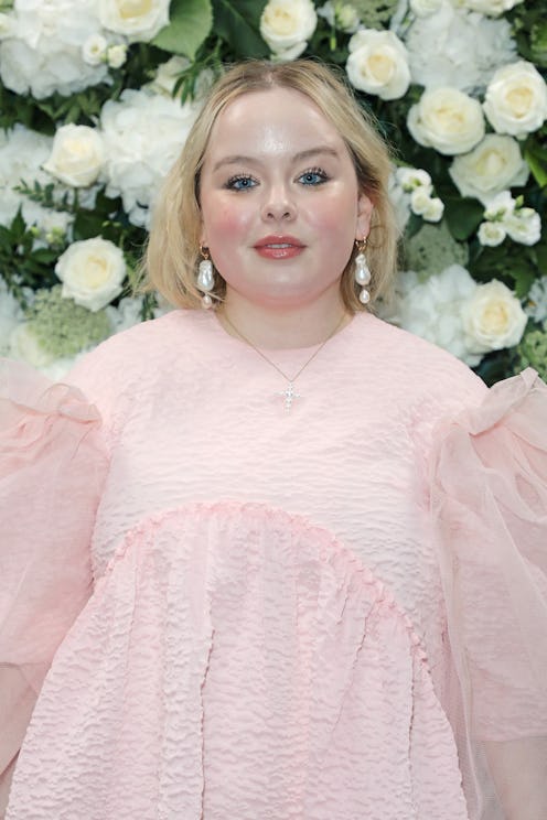 Nicola Coughlan posing at a party