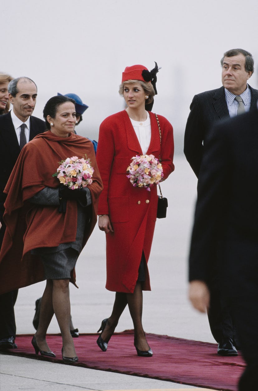 Princess Diana wearing a red Chanel outfit at Orly Airport near Paris, France, in November 1988.