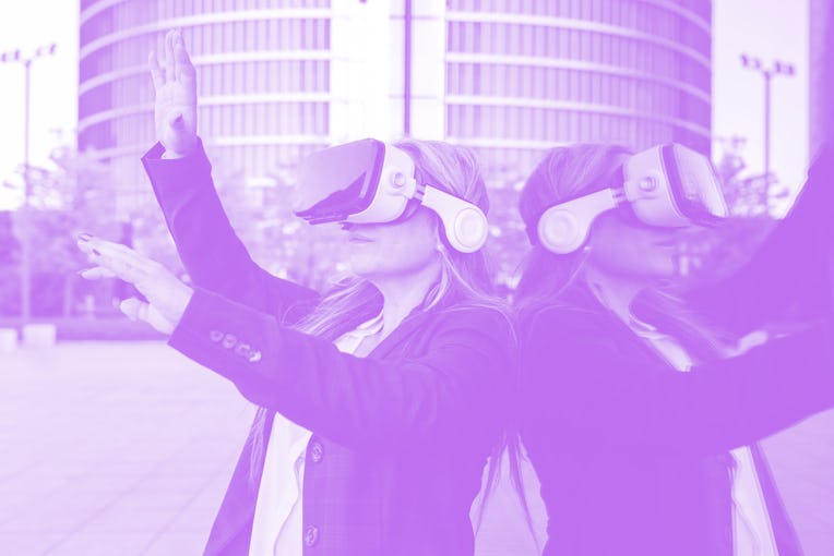 mature business woman wearing virtual reality glasses