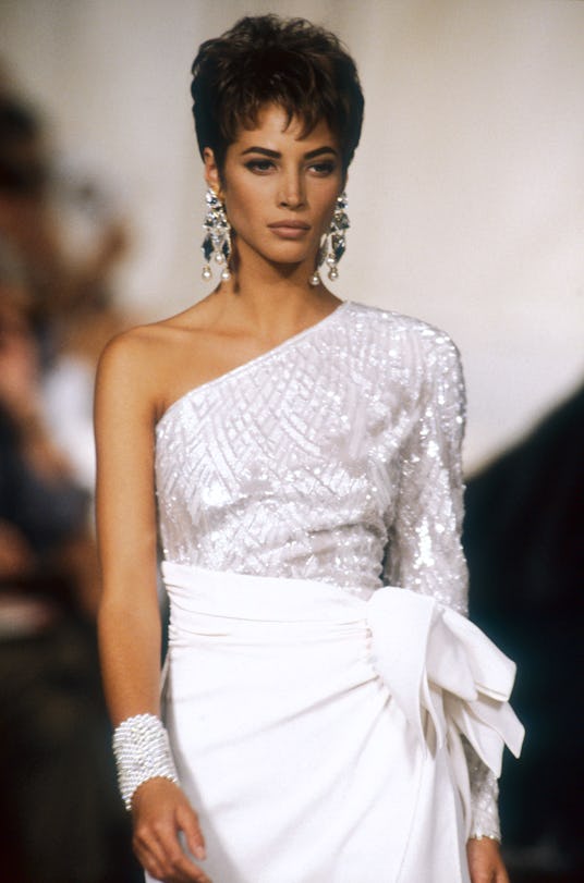 Model Christy Turlington wears women's haute couture fashions from Italian fashion house Valentino i...