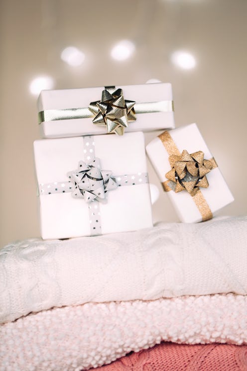 Stack of multicolored knitted sweaters. Front view. Winter concept.