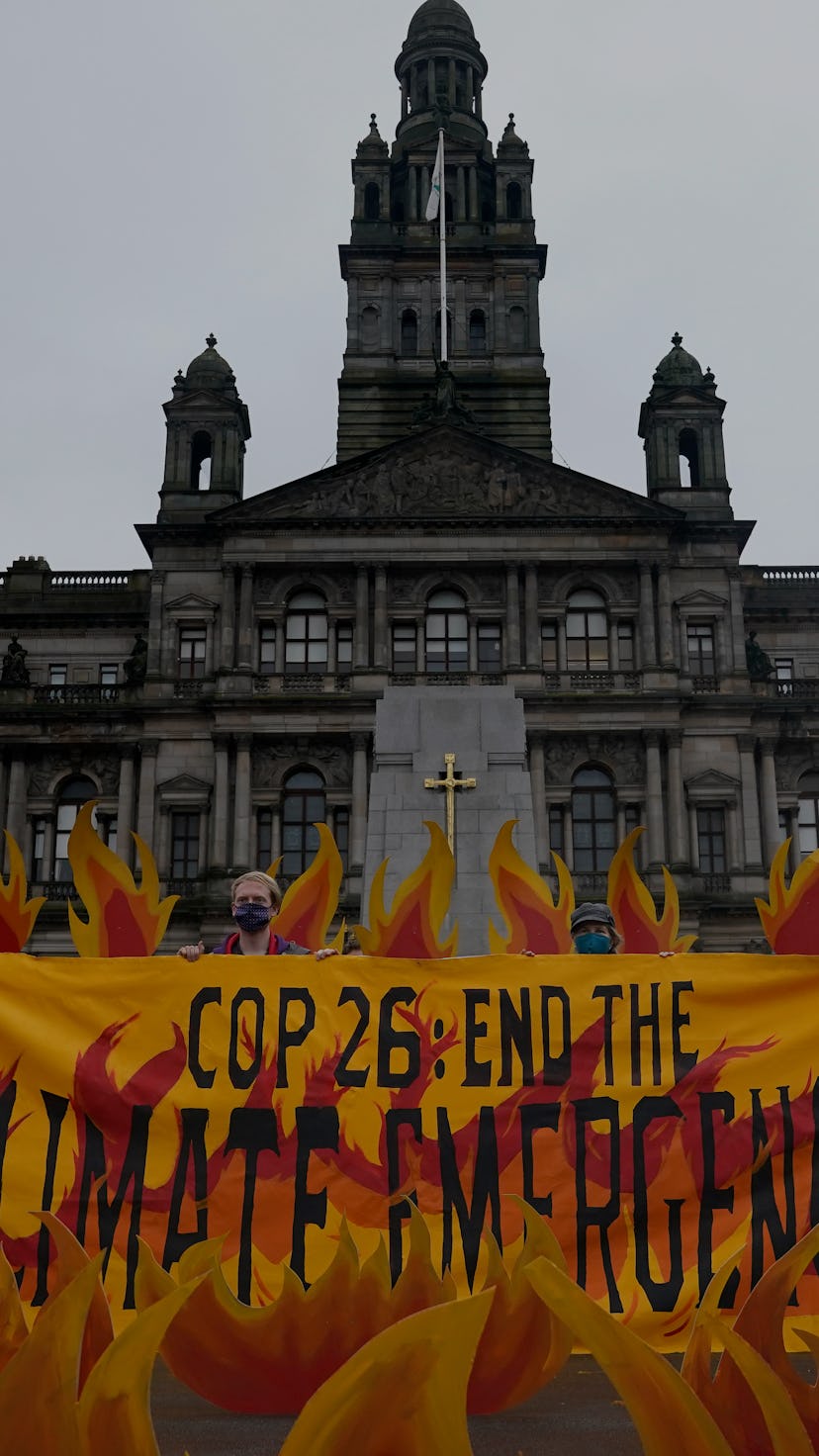 Climate activists "set fire" to George Square, Glasgow, with an art installation of faux flames, smo...