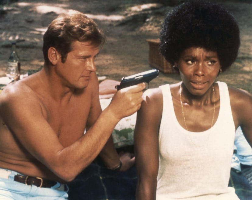 Actor Roger Moore and actress Gloria Hendry on the set of “Live And Let Die”. (Photo by Sunset Boule…