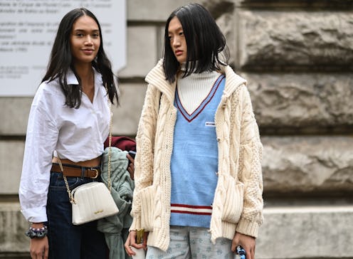 PARIS, FRANCE - OCTOBER 01: Model Tia Wan and Yilan Hua are seen outside the Loewe show during Paris...