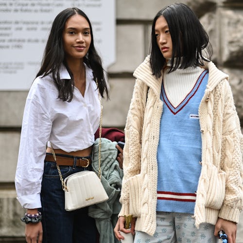 PARIS, FRANCE - OCTOBER 01: Model Tia Wan and Yilan Hua are seen outside the Loewe show during Paris...