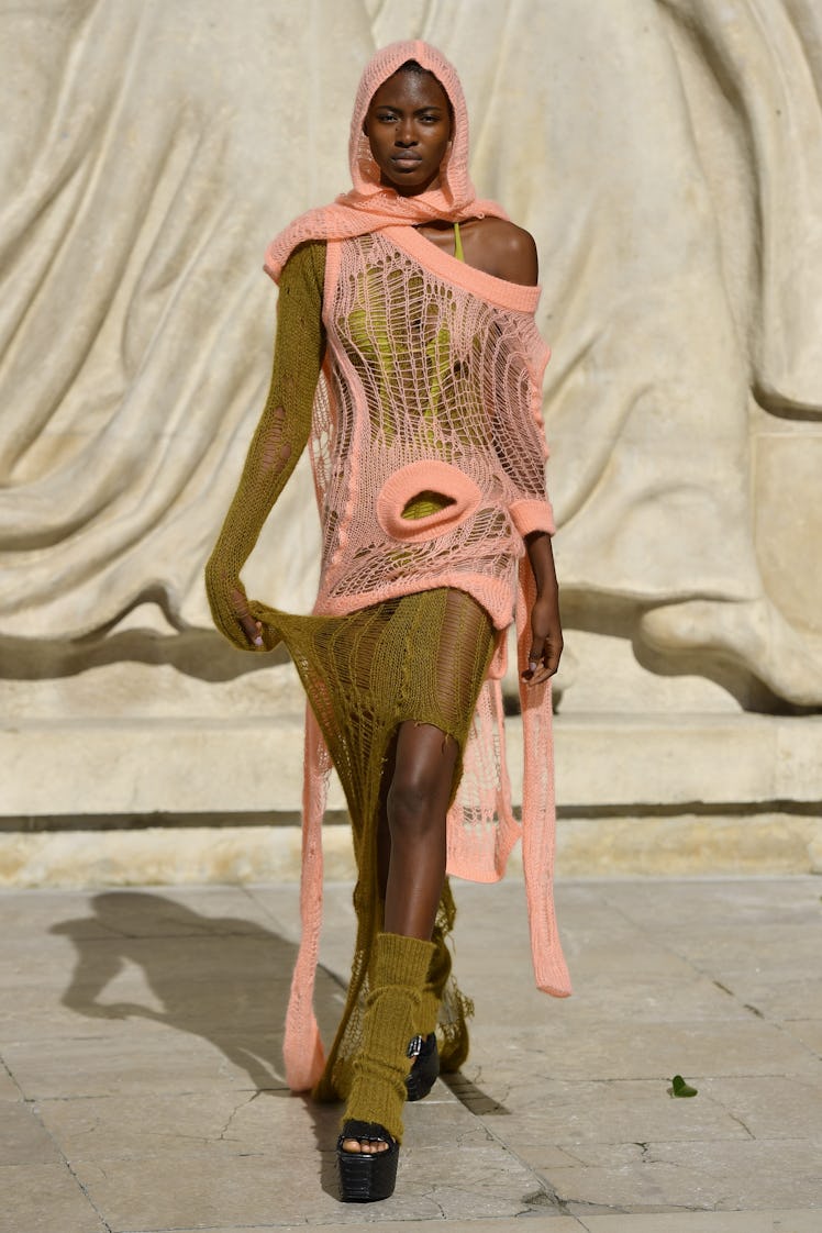 A model walking in a pink green dress at the Rick Owens Womenswear Spring/Summer 2022 show