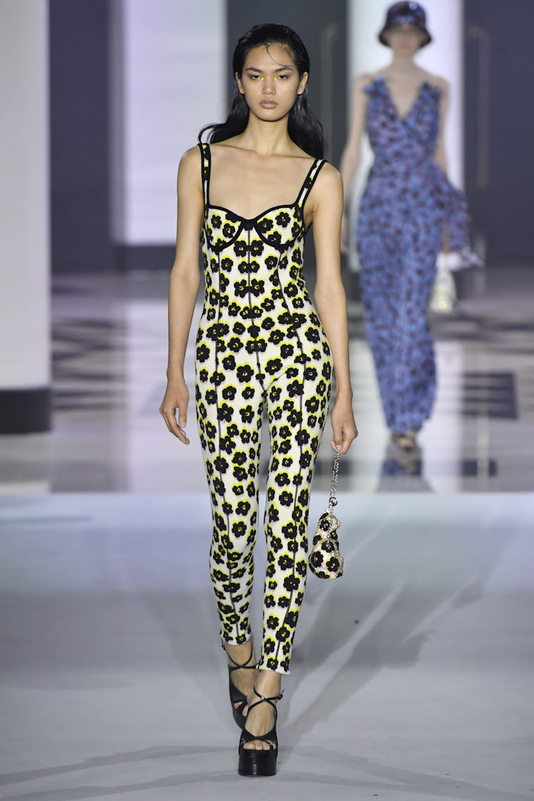 A model walking in a floral black-white dress at the Lanvin Ready to Wear Spring/Summer 2022 show 