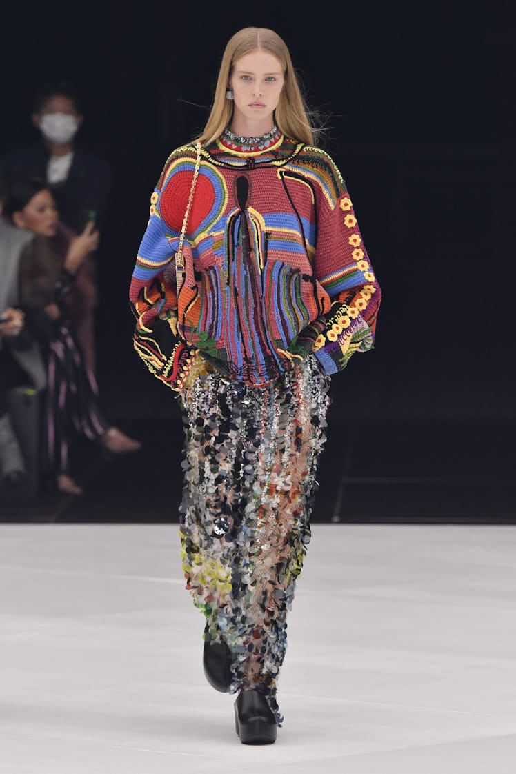 A model walking in multi-colored patterned outfit at the Givenchy Ready to Wear Spring/Summer 2022 f...