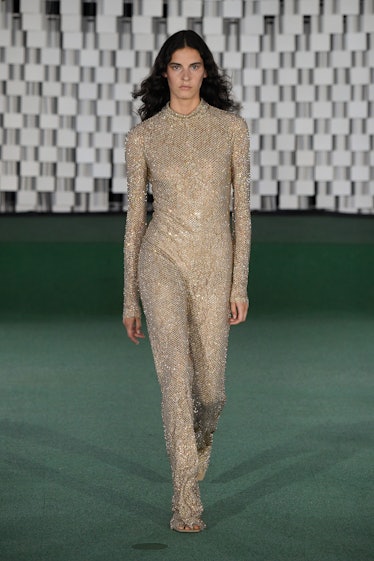 A model walking in a beige sequin jumpsuit at the Stella McCartney Womenswear Spring/Summer 2022 sho...