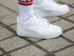PARIS, FRANCE - JUNE 03: Patricia Contreras wears white and red Obey ankle socks, white leather Nike...
