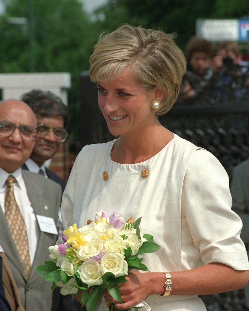 Princess Diana wearing her Cartier gold tank watch in Neasden, London. 