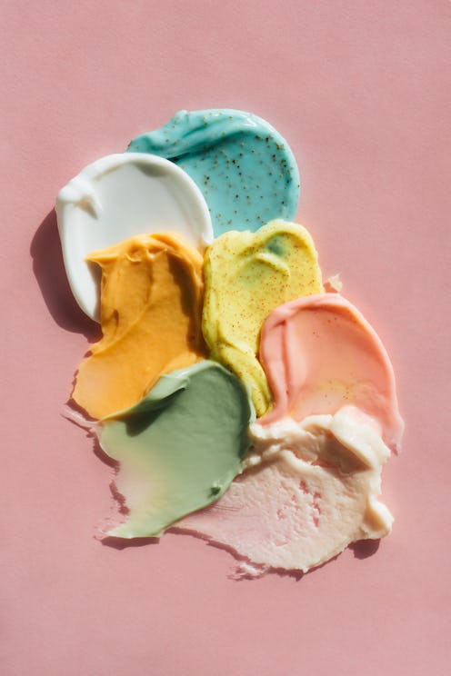 Set multicolored smears of illuminating yellow scrub with exfoliating particles and white, beige, ro...