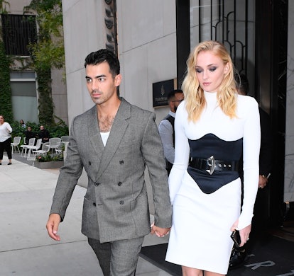 Sophie Turner wears white dress and black corset while walking in SoHo with husband Joe Jonas on Aug...
