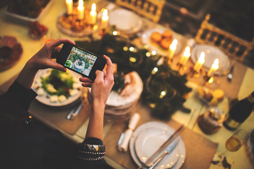 Showing off your table setting is one idea for Thanksgiving family pictures.