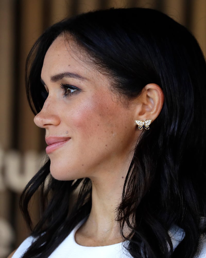  Meghan Markle wearing Princess Diana's butterfly earrings on her first royal tour in October 2018. 