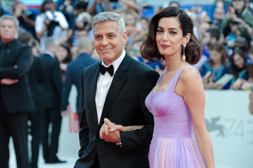 American actor George Clooney with his wife Amal Clooney during the Suburbicon premiere on the occas...