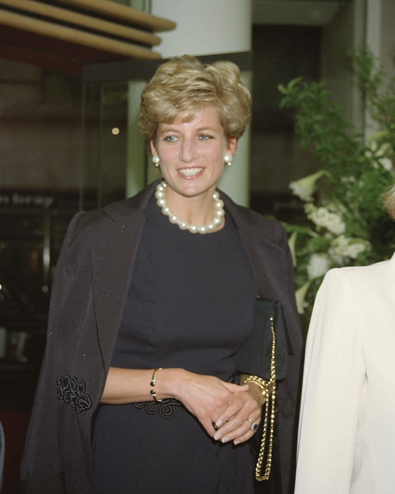 Princess Diana wearing her gold and blue stone cuff in Mayfair in May 1994. 