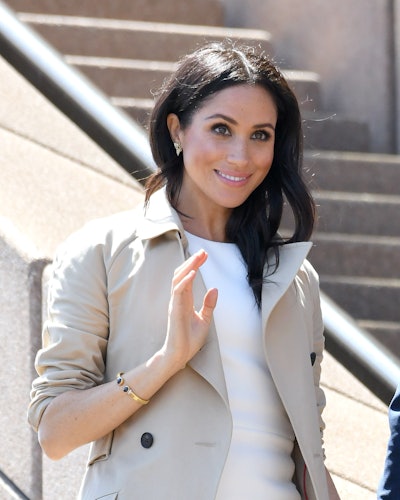 Meghan Markle wearing Princess Diana's gold and blue stone cuff in Sydney, Australia in October 2018...