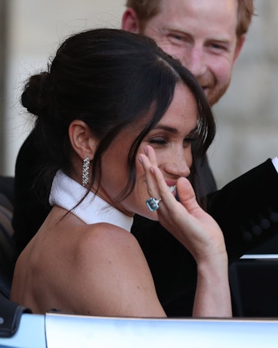 Meghan Markle wears Princess Diana's aquamarine ring to her wedding reception. 