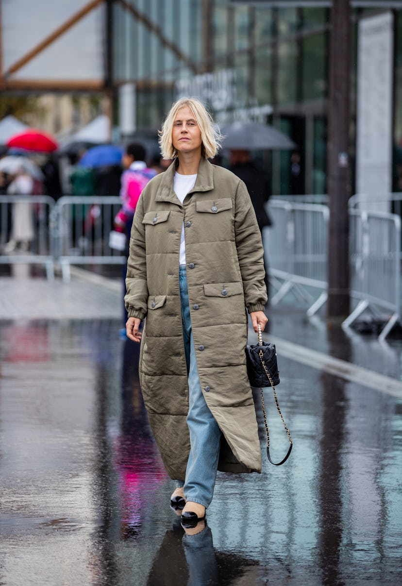 PARIS, FRANCE - OCTOBER 05: Linda Tol seen wearing bag, olive coat, denim jeans outside Chanel durin...