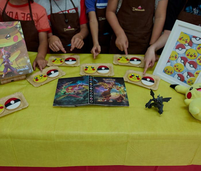 MADRID, SPAIN - AUGUST 16: Several children show the Pokemon cookies they have made at a summer camp...
