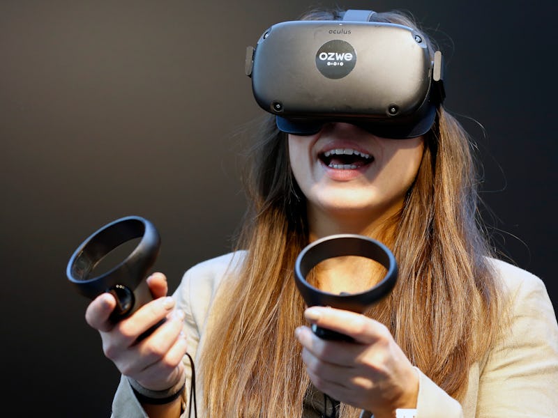 PARIS, FRANCE - NOVEMBER 21: A visitor tries a virtual reality helmet Oculus Quest during the Virtua...