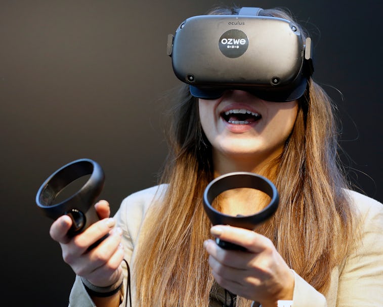 PARIS, FRANCE - NOVEMBER 21: A visitor tries a virtual reality helmet Oculus Quest during the Virtua...