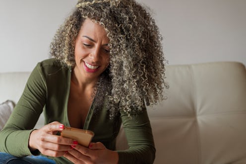 A woman uses Instagram Video, the platform's rebrand of IGTV.