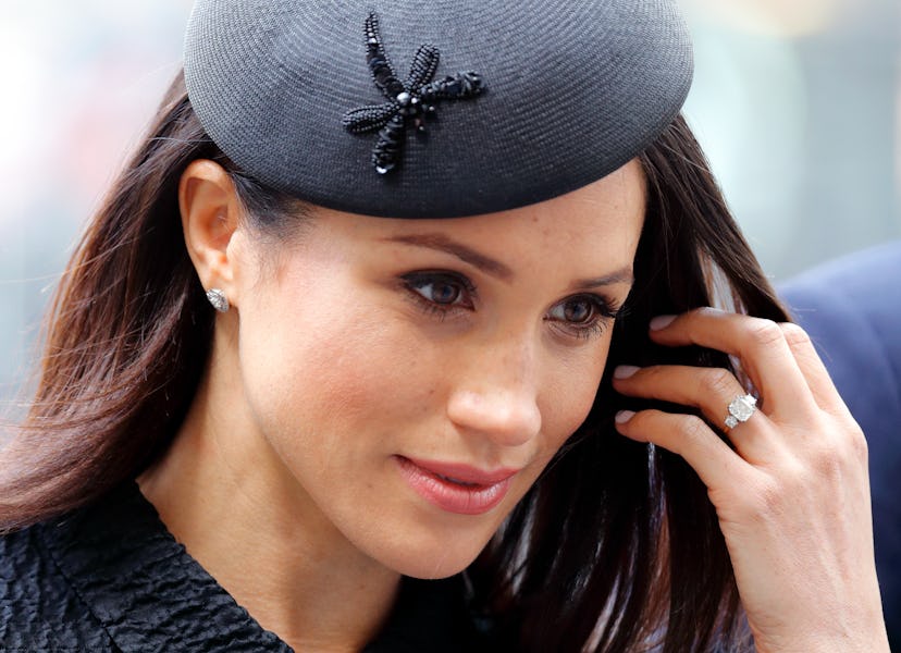 Meghan Markle wearing Princess Diana's diamonds in her engagement ring. 