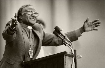 South African religious leader and activist Bishop Desmond Tutu gestures as he gives a speech at th...