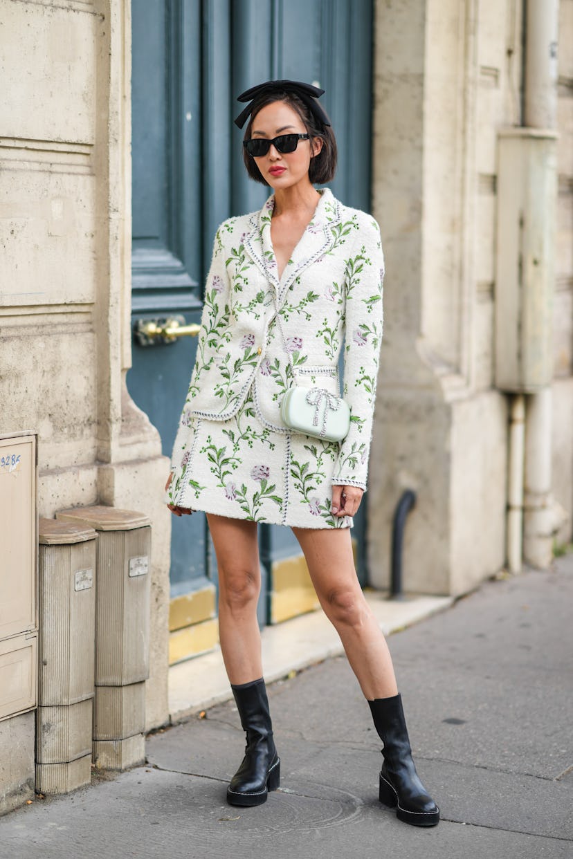 PARIS, FRANCE - OCTOBER 04: Chriselle Lim wears sunglasses, a black knotted headband, a white tweed ...