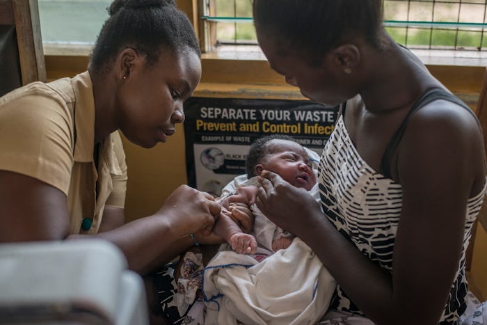 A nurse administers a vaccine to a child at Ewin Polyclinic in Cape Coast on April 30, 2019. - Ewim ...