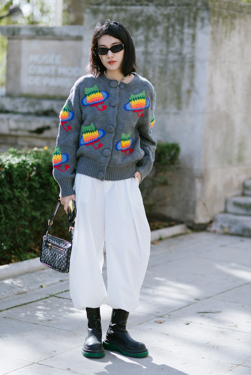 PARIS, FRANCE - OCTOBER 04: Yishan Li poses wearing a Uooya jumper after the Giambattista Valli show...