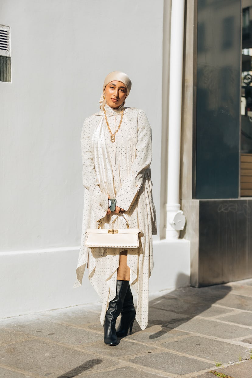 PARIS, FRANCE - OCTOBER 02: Hijabi influencer Taqwa Bintali wears an all white Fendi outfit - Fendi ...