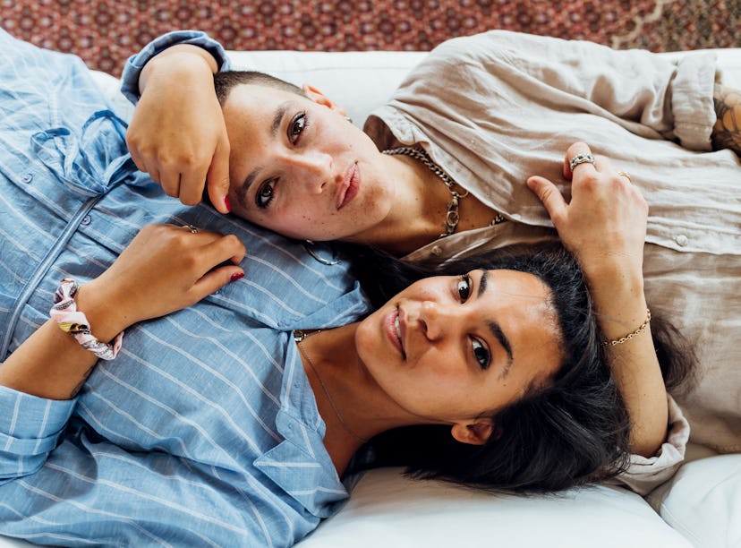 Two young women laying side by side on Nov. 30, 2021, the most romantic day of the month for every z...