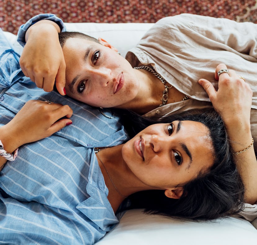Two young women laying side by side on Nov. 30, 2021, the most romantic day of the month for every z...
