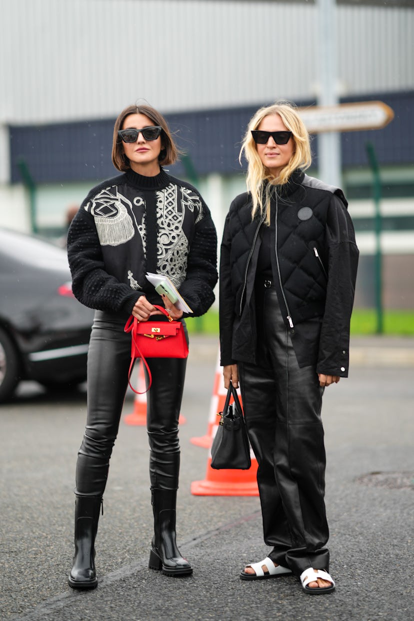 PARIS, FRANCE - OCTOBER 02: (L-R) Alexandra Pereira wears black sunglasses, a black with white embro...