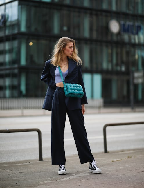 A high-top sneaker outfit with a blazer, crop top, and trousers.
