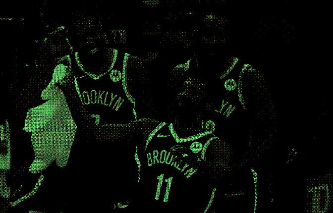 Boston - May 30: The Nets Kyrie Irving waves a towel in celebration as the final seconds ticked off ...