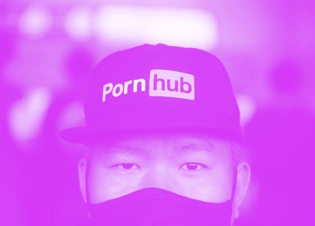 BANGKOK, THAILAND - 2020/11/03: A man looks on while wearing a cap with the Pornhub logo during a pr...
