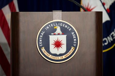 The lectern stands empty as reporters await the arrival of Director of Central Intelligence Agency J...