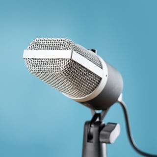 microphone for audio record or Podcast concept, single microphone on soft blue background with copy...