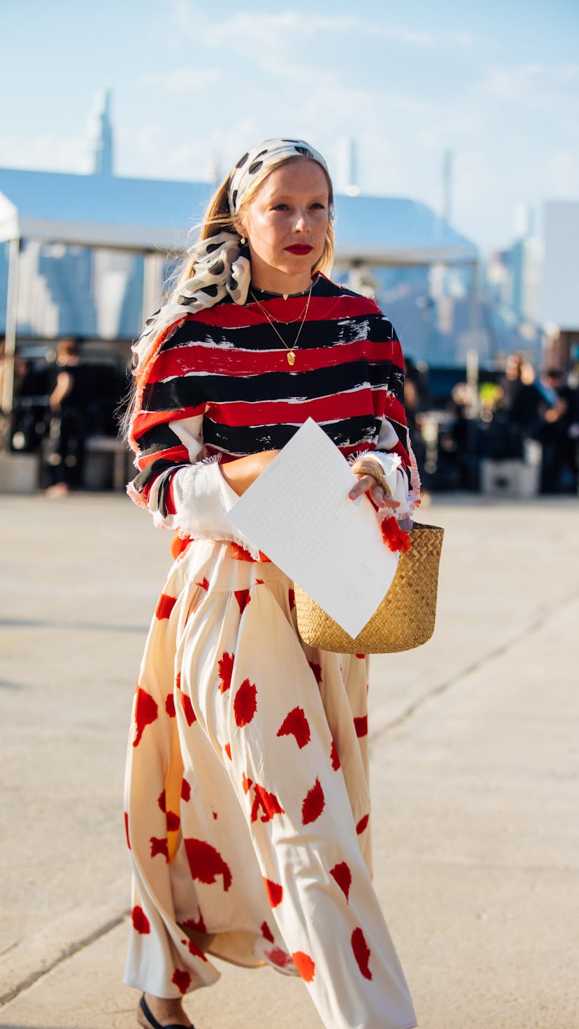 NEW YORK, NEW YORK - SEPTEMBER 08: Chloe King wears a white spotted head accessory, black and red st...