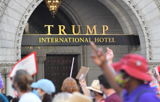 Protesters march past the Trump International Hotel as they take part in the Women's March and Rally...